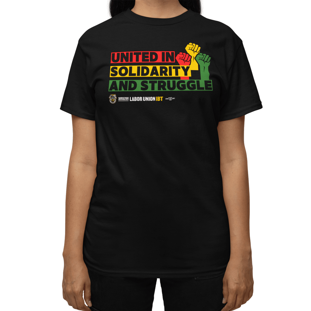 Black t-shirt with colorful text and graphic on a white background