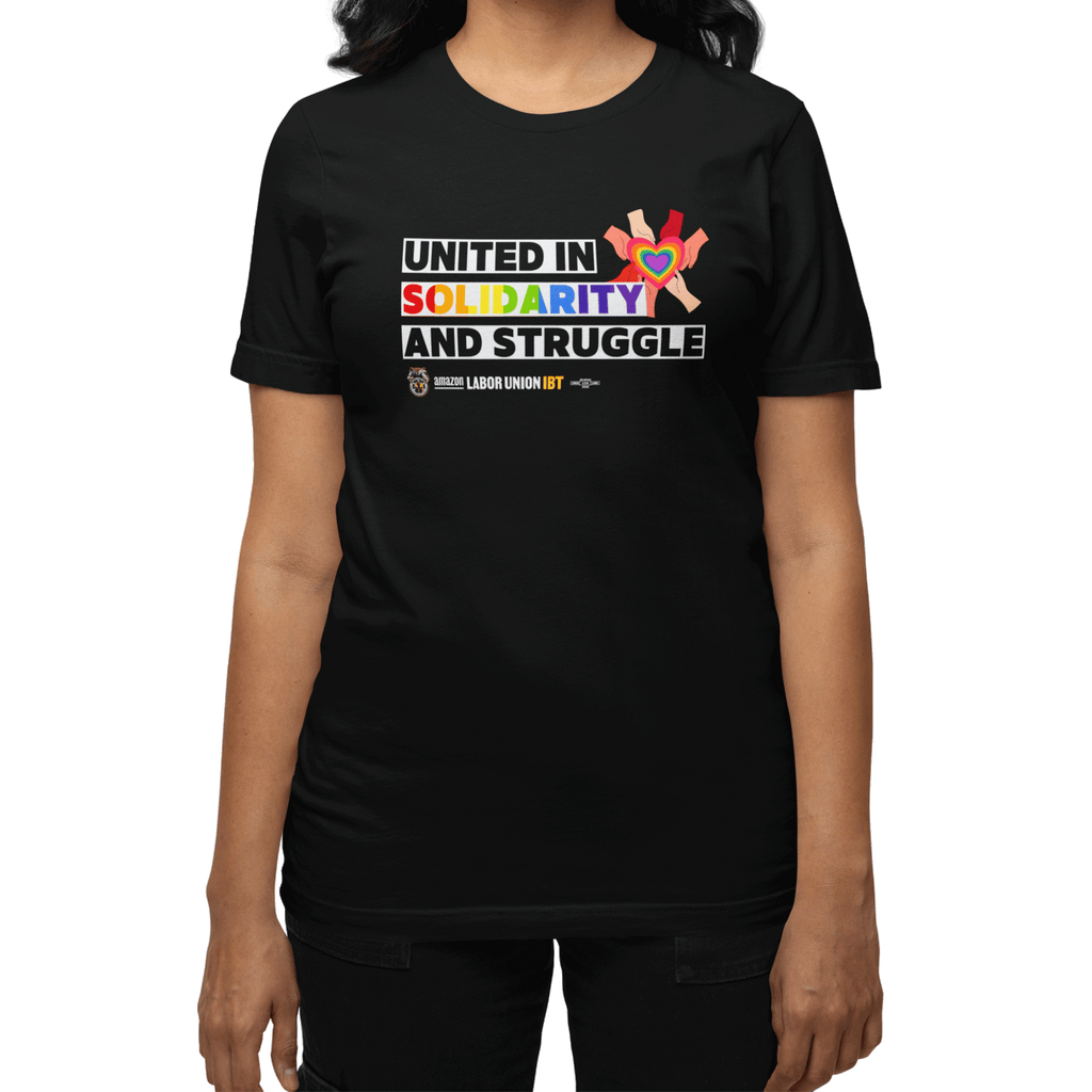 Black t-shirt with colorful text and graphics on a white background