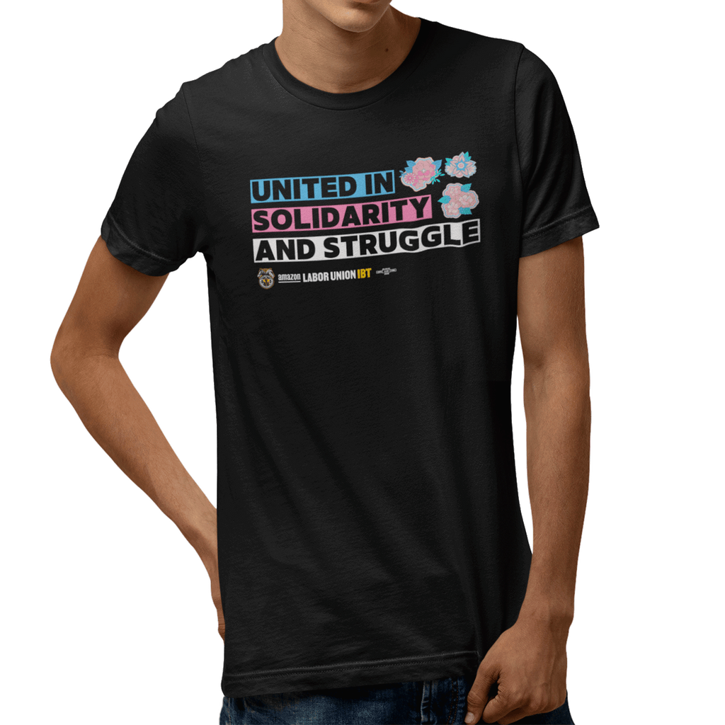 Black t-shirt with colorful text and graphics on a white background